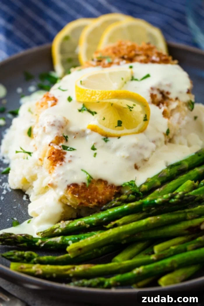 This Week's Menu: April 22-28 8 A plate of golden-brown Panko Crusted Chicken drizzled with a rich and tangy Lemon Cream Sauce, presented elegantly as an award-winning recipe.