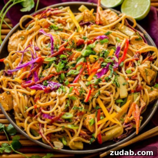 Your Weekly Meal Plan: May 6-12 6 A vibrant and appetizing close-up of Thai Peanut Noodles, generously coated in a rich, savory peanut sauce, and tossed with fresh, colorful vegetables.