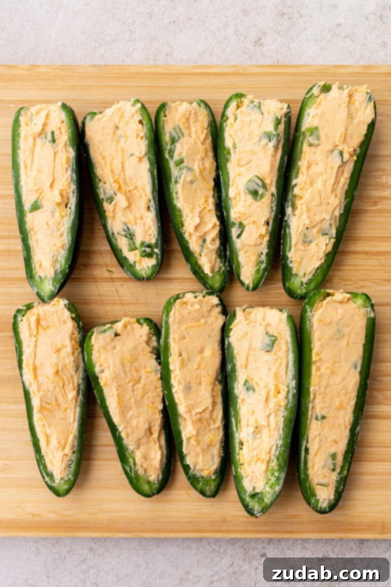 Effortless Air Fryer Jalapeño Poppers 5 Step-by-step image of mixing the cream cheese filling