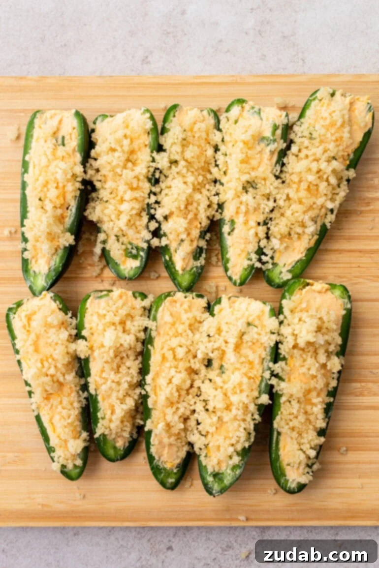 Effortless Air Fryer Jalapeño Poppers 6 Step-by-step image of filling the jalapeño halves with cheese mixture