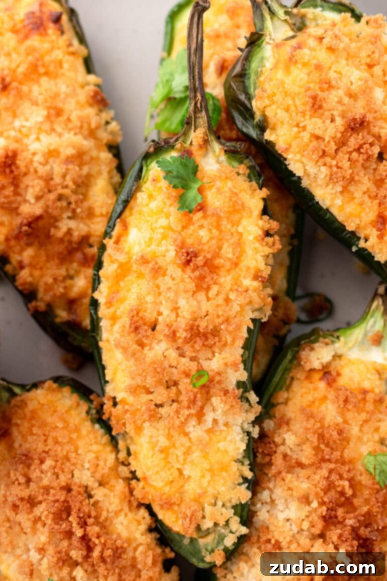 Effortless Air Fryer Jalapeño Poppers 10 A close up photo taken over the top of golden air fryer jalapeno poppers