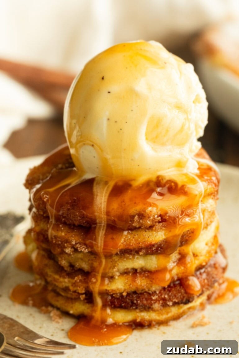 Effortless Air Fried Apple Rings 6 a stack of golden fried apple rings topped with a scoop of vanilla ice cream and drizzled with warm caramel