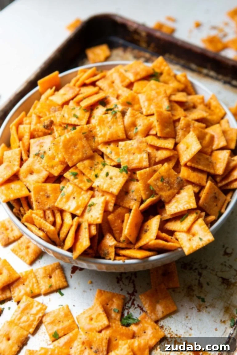Olympic Celebrations: Red, White, and Blue Recipes 16 a large white bowl full of seasoned smoked cheezits with some spilling over the sides of the bowl.