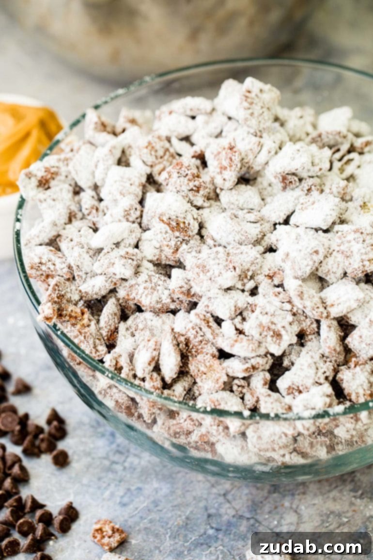 Olympic Celebrations: Red, White, and Blue Recipes 18 A photo of muddy buddies snack mix in a glass bowl.