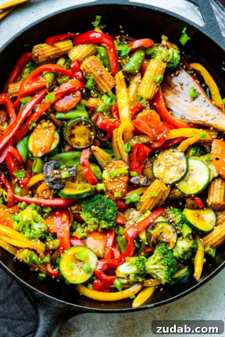 My Go-To Speedy Veggie Stir-Fry 2 A vibrant and colorful vegetable stir fry, brimming with fresh ingredients, served in a large cast iron skillet.