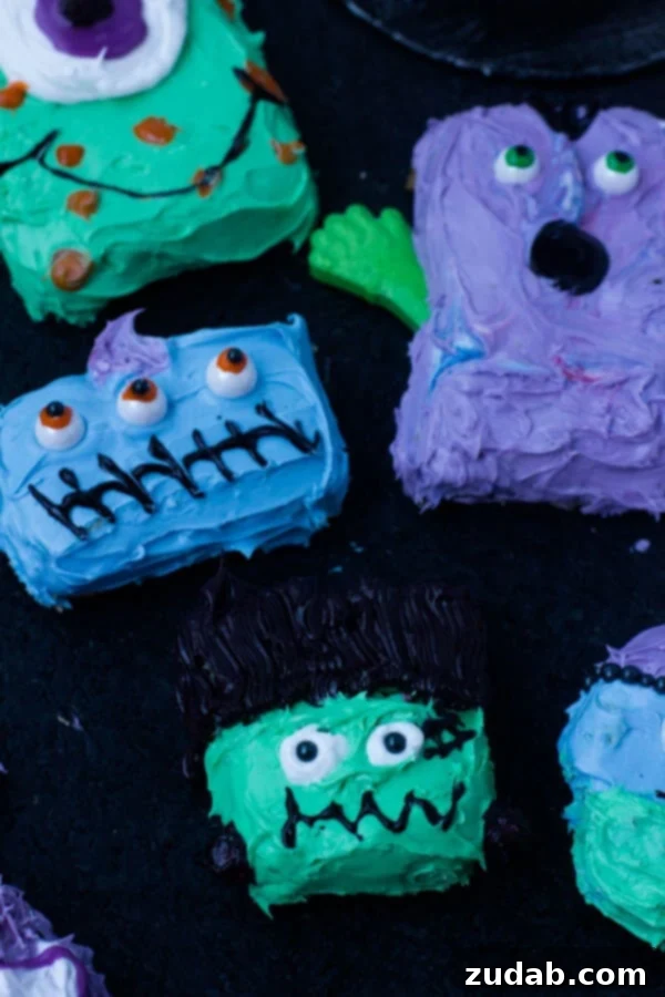 Fun Halloween Cookie Monsters: Easy to Make with Kids! Vibrant and spooky Halloween cookie monsters with candy eyes, perfect for a fun party