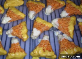 Sweet Tooth Savages 6 Festive Candy Corn Rice Krispie Treats arranged beautifully on a plate, ideal for fall and Halloween celebrations