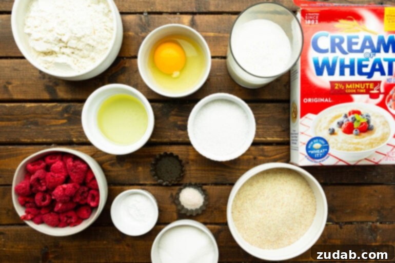 Raspberry Burst Cream of Wheat Muffins 4 A beautifully arranged flat lay photo of all the individual ingredients required for Cream of Wheat Raspberry Muffins, neatly portioned into small bowls on a rustic surface.