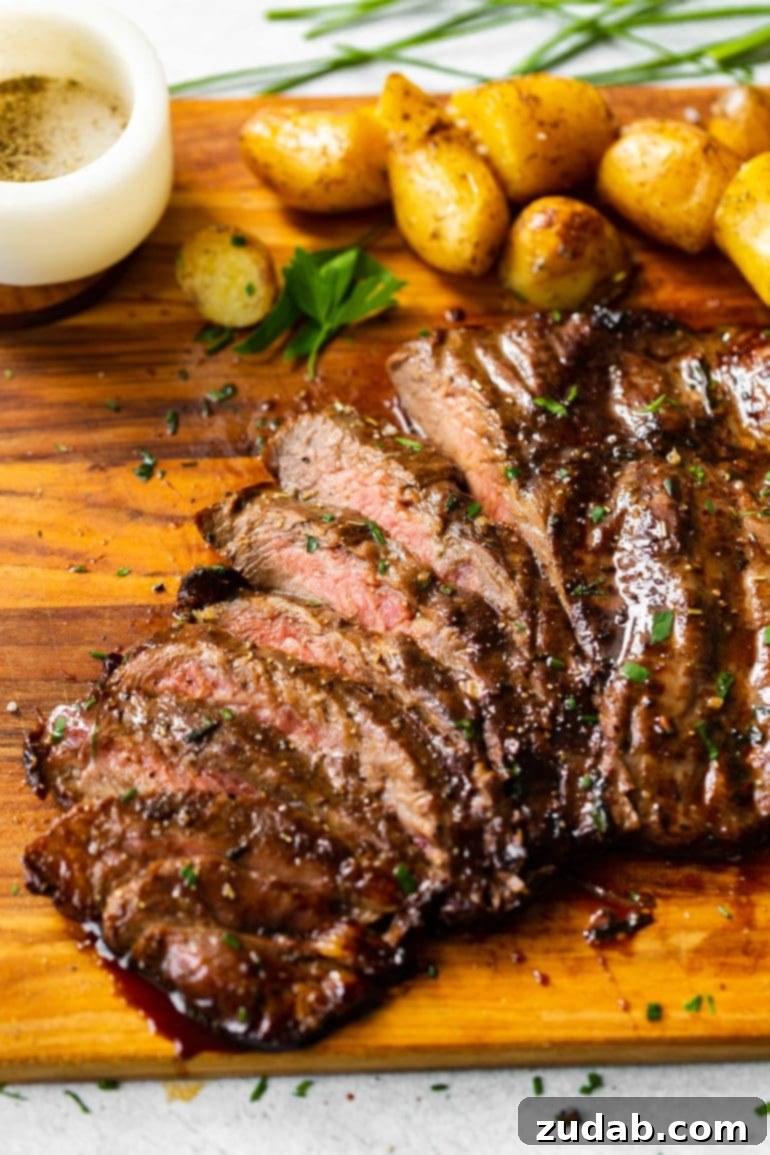 This Week's Meal Plan: September 23-29 8 A rustic cutting board laden with perfectly roasted Yukon Gold potatoes and beautifully sliced grilled flank steak, glistening with a savory balsamic marinade, ready to be served.