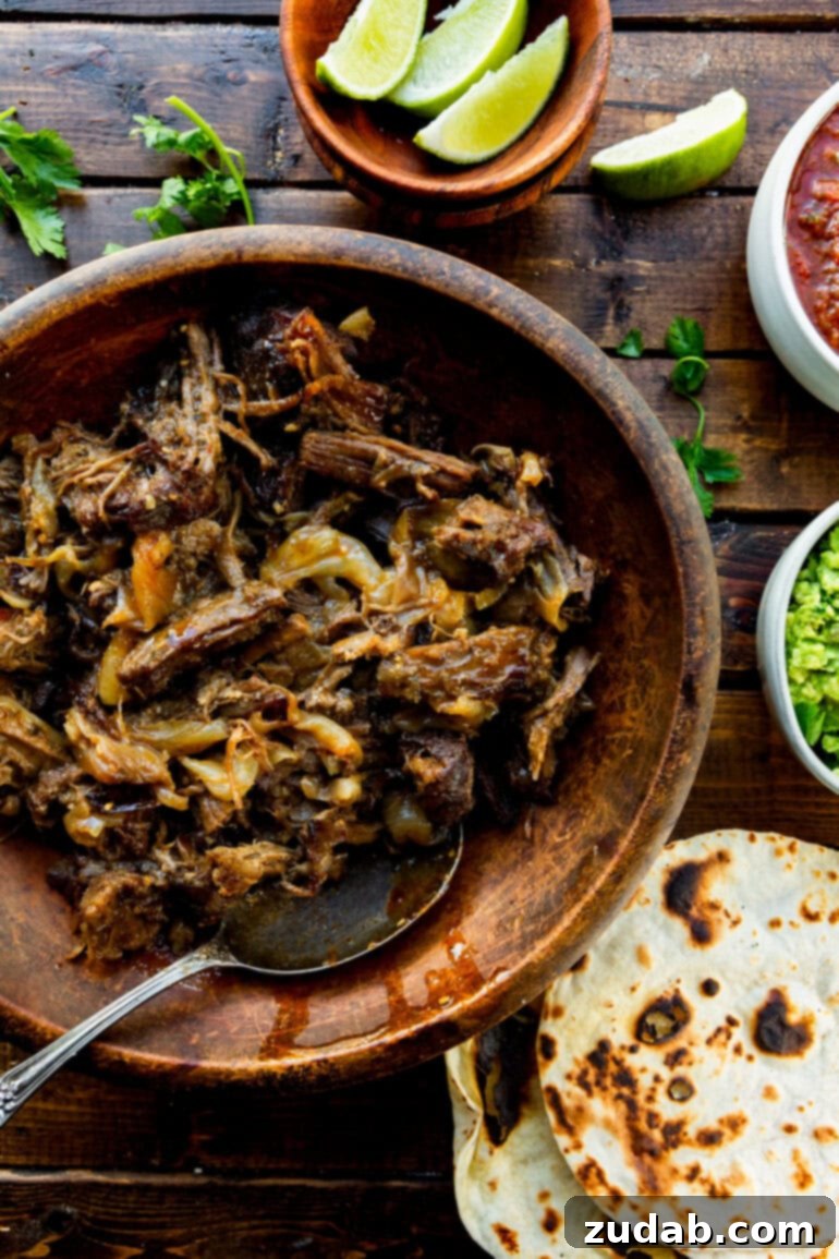 Deliciously Easy 5-Ingredient Shredded Beef Tacos 8 Perfectly seasoned and irresistibly tender shredded beef, showcasing its appealing texture and rich color.