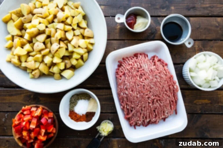 Quick & Hearty Beef and Potato Skillet 3 An organized photo showcasing all the individual ingredients for the ground beef and potatoes recipe, neatly arranged in small bowls and plates, illustrating the simplicity of the components.