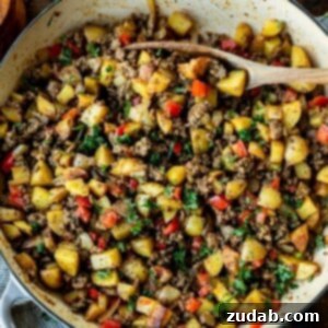 A perfectly cooked one-pot ground beef and potato skillet, ready to serve.