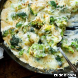 Parmesan Garlic Velvet Broccoli 9 A large skillet filled with creamy broccoli topped with broiled, golden-brown cheese