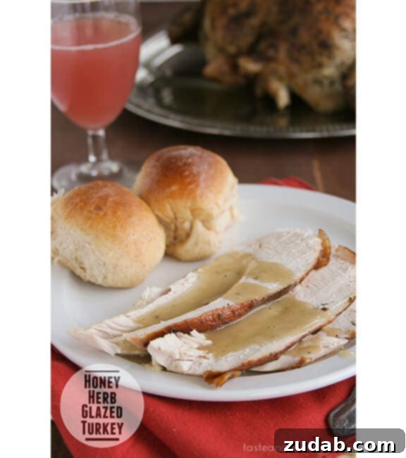Juicy Herb Roasted Turkey Breast 9 Honey-Herb-Glazed-Turkey recipe, a beautiful golden brown turkey with herbs.