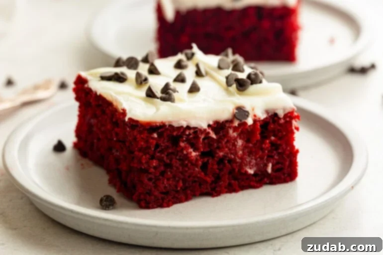 The Ultimate Red Velvet Poke Cake: Foolproof & Delicious 2 Moist Red Velvet Poke Cake with Cream Cheese Frosting and Chocolate Chips
