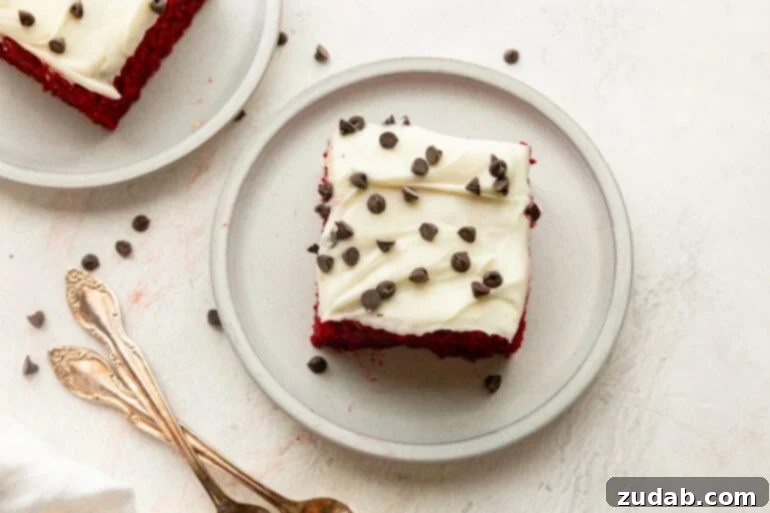 The Ultimate Red Velvet Poke Cake: Foolproof & Delicious 3 Slice of Red Velvet Poke Cake with Cream Cheese Frosting and Chocolate Chips