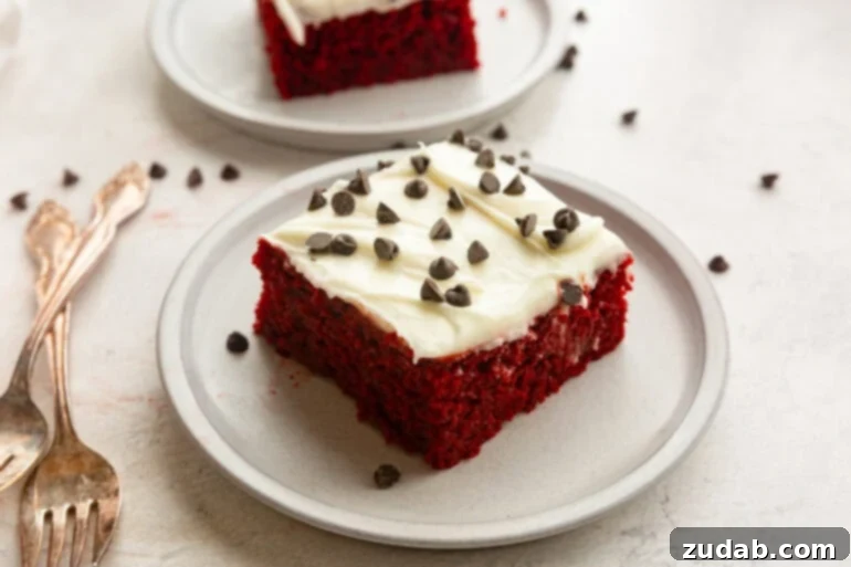 The Ultimate Red Velvet Poke Cake: Foolproof & Delicious 6 Piece of Red Velvet Poke Cake with Cream Cheese Frosting and Chocolate Chips