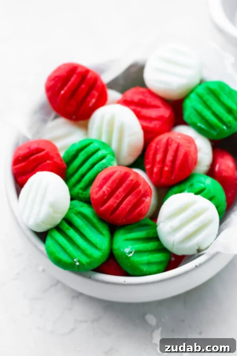 Classic Cream Cheese Mints: A Nostalgic Treat 2 A bowl of homemade cream cheese mints in red, white, and green