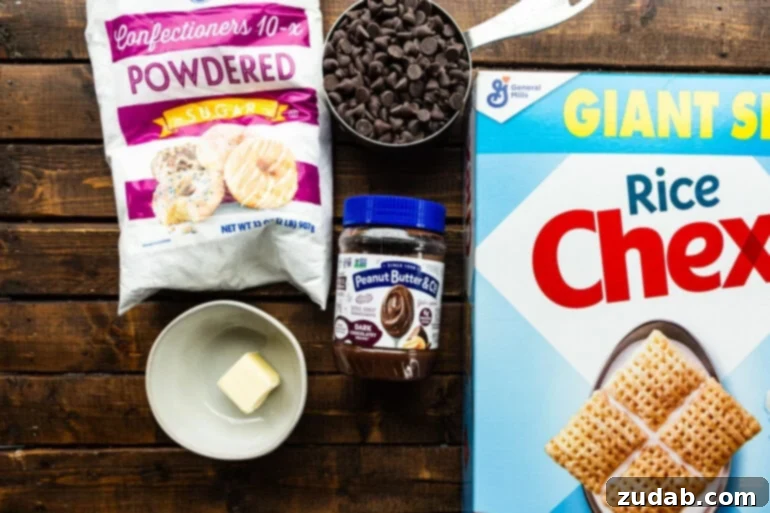 Decadent Dark Chocolate Peanut Butter Muddy Buddies 4 all the ingredient for dark chocolate muddy buddies sitting on a wooden table including a box of rice chex cereal, chocolate chips, butter, powdered sugar and dark chocolate peanut butter spread