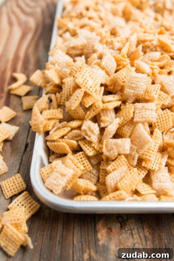 Sweet Gooey Chex Mix, a classic party snack from Oh Sweet Basil