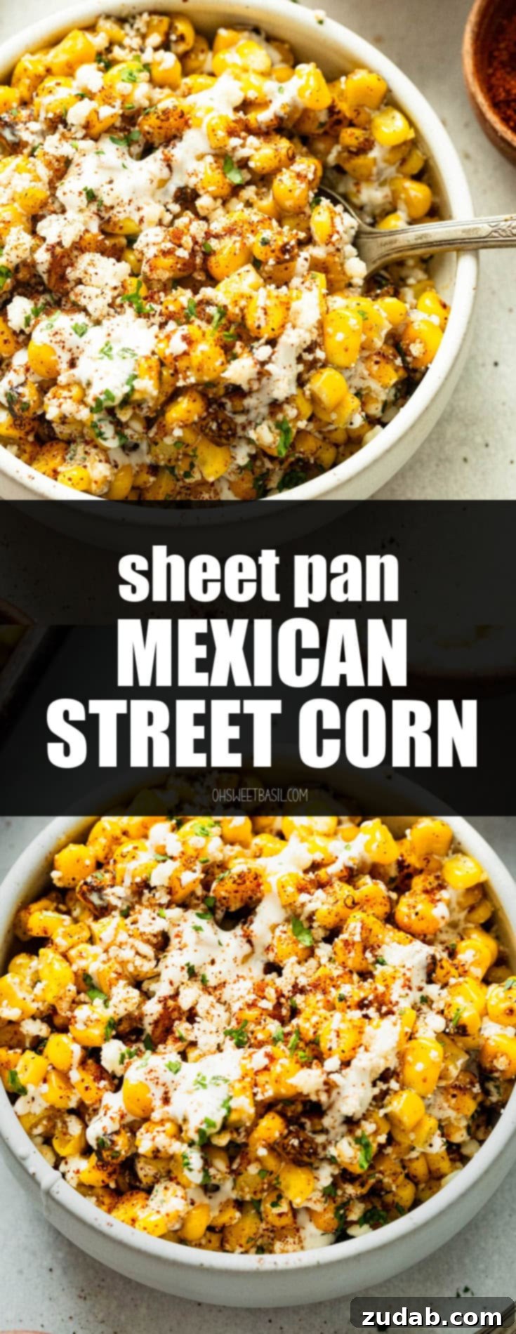 Oven Baked Sheet Pan Mexican Street Corn 10 A large white serving bowl filled with a generous portion of roasted Mexican street corn, beautifully garnished with extra crumbled cotija cheese, a dusting of chili powder, and fresh green cilantro.