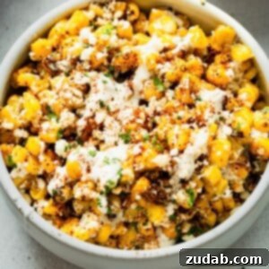 A bowl of Sheet Pan Mexican Street Corn, ready to serve.