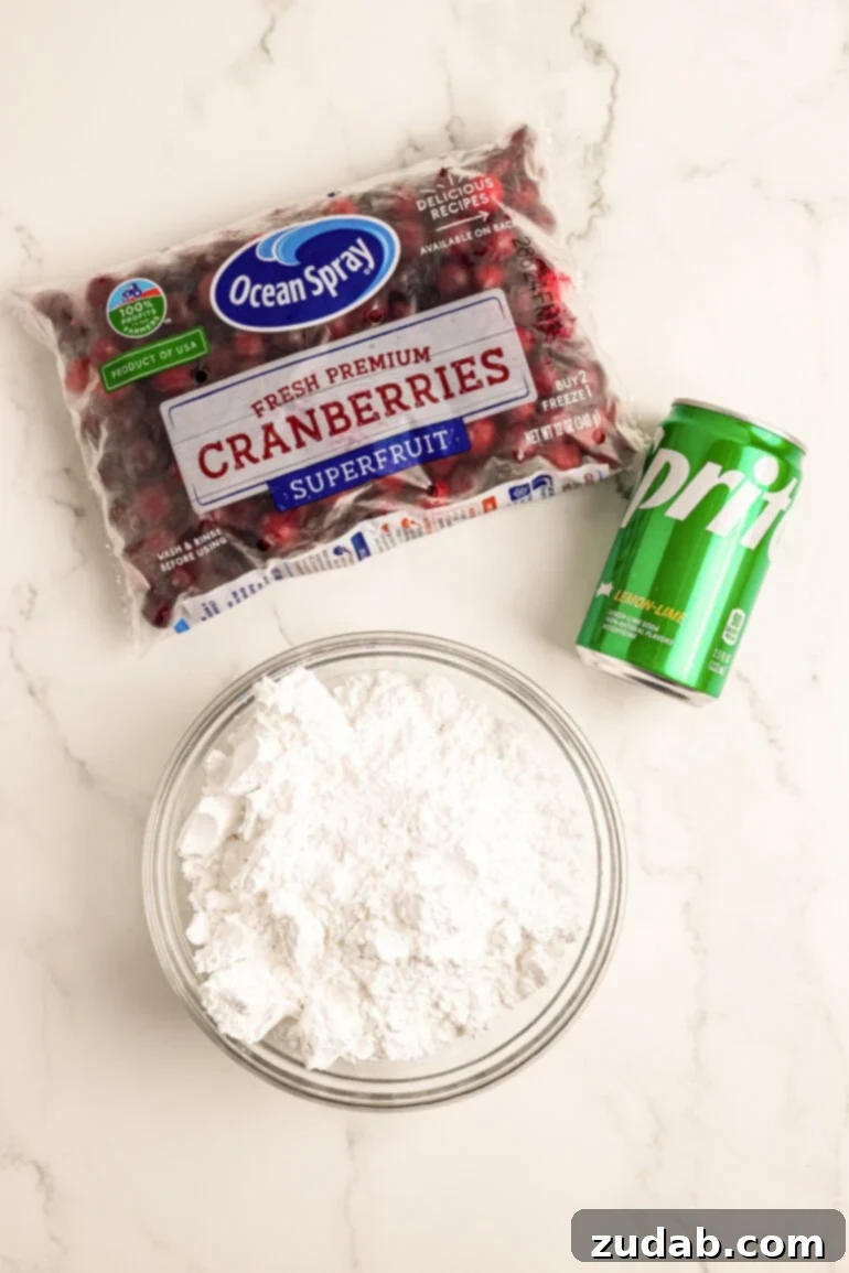 Sparkling Sweet Tart Cranberry Craze 3 The three ingredients needed for candied cranberries: a bag of whole cranberries, a can of Sprite, and a bowl of powdered sugar. Simple ingredients for a magical holiday treat!