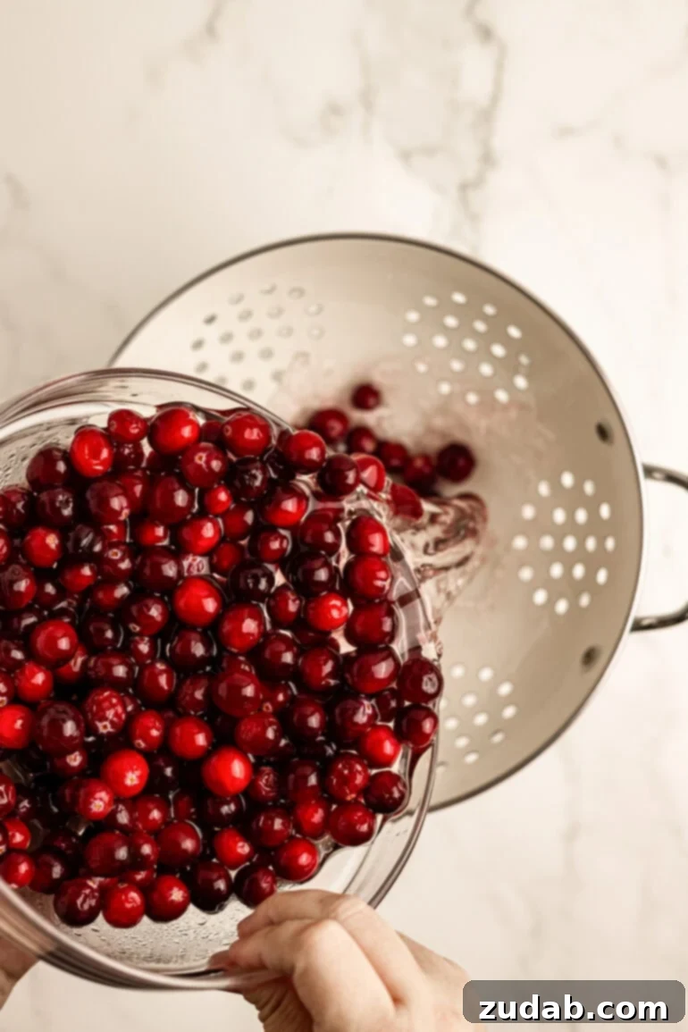 Sparkling Sweet Tart Cranberry Craze 4 Fresh cranberries soaking in Sprite in a bowl, the first step to making sugared cranberries.