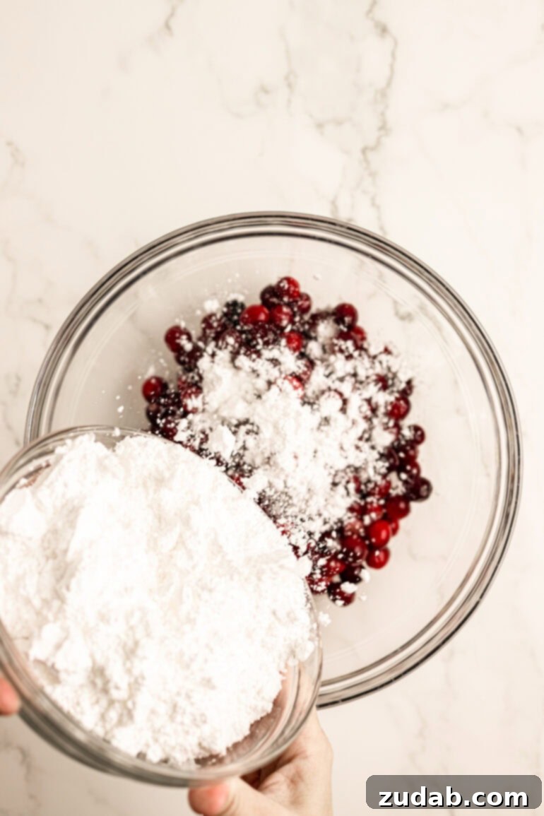 Sparkling Sweet Tart Cranberry Craze 6 Sugar-coated cranberries spread out on a baking sheet, ready for a quick bake.