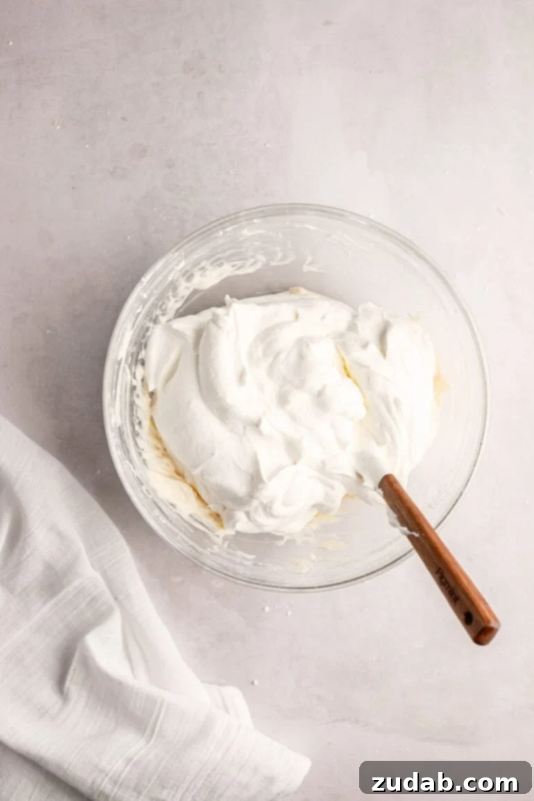 Light and Fluffy Cream Cheese Frosting 9 Step-by-step image showing the final, perfectly combined and fluffy whipped cream cream cheese frosting.