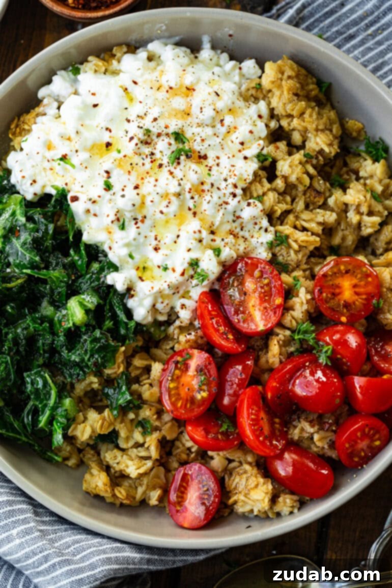7 Minute High Protein Savory Cottage Cheese Oats 9 a photo taken over the top of a savory oatmeal cottage cheese breakfast bowl with tomatoes and kale