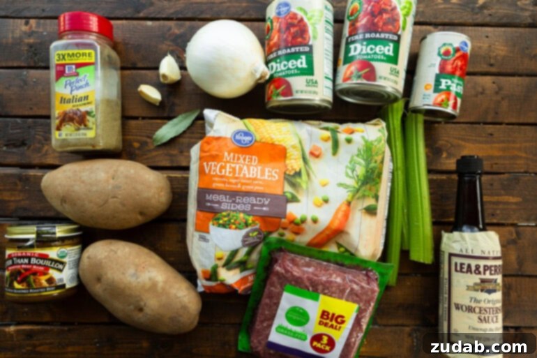 Quick and Easy Ground Beef Vegetable Soup 4 All the fresh ingredients for ground beef vegetable soup laid out, including lean ground beef, russet potatoes, celery, mixed frozen vegetables, onion, garlic, and diced tomatoes.