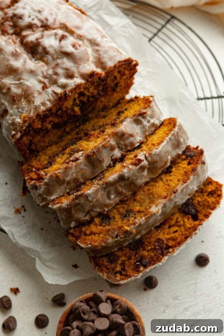 Heavenly Pumpkin Chocolate Chip Loaf 6 A festive display of pumpkin chocolate chip bread, with slices artfully arranged next to the loaf.