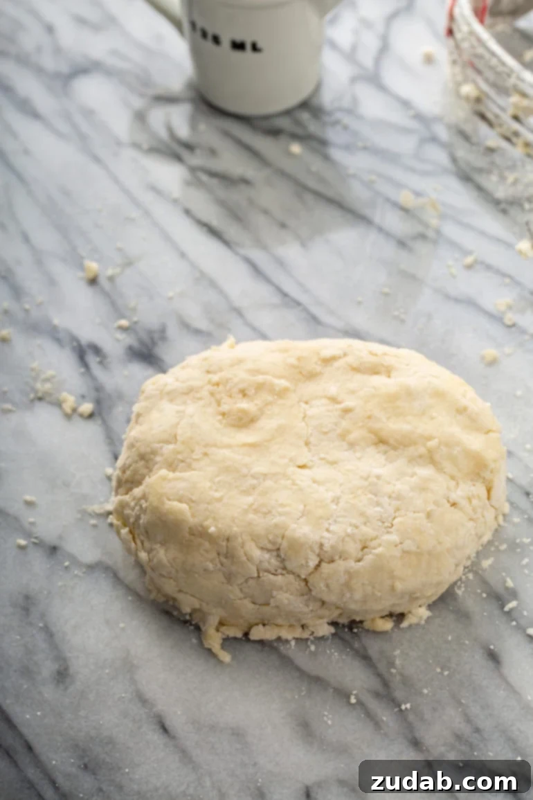My Go-To Flaky All-Butter Pie Crust 5 A ball of pastry on a table top.