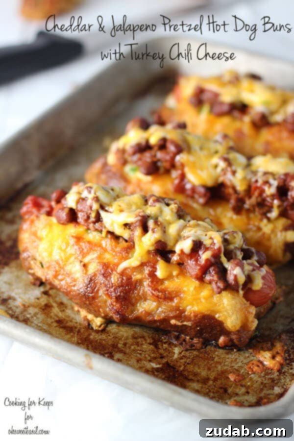 Jalapeño & Cheddar Pretzel Hot Dog Buns with Turkey Chili Cheese - The Ultimate Hot Dog Experience Jalapeño and Cheddar Pretzel Hot Dog Buns with savory Turkey Chili Cheese - a gourmet twist on a classic for Fourth of July celebrations.