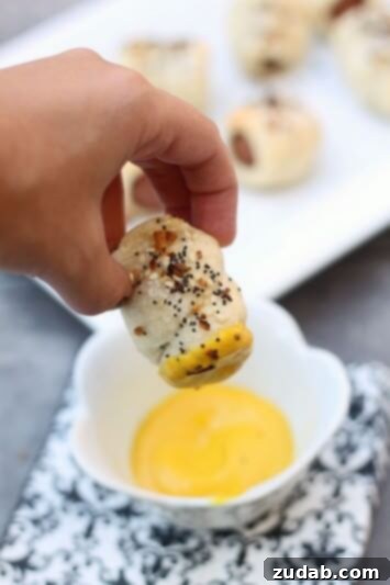 Jalapeño Cheddar Pretzel Hot Dogs with Turkey Chili Cheese 6 Homemade Pretzel Pigs in a Blanket, a fun and delicious snack or appetizer wrapped in soft, chewy pretzel dough.