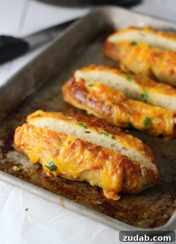 Homemade Jalapeño Cheddar Pretzel Buns Gourmet hot dog buns made from fluffy, chewy pretzel dough, studded with spicy jalapeños and sharp cheddar cheese, for an unforgettable meal.