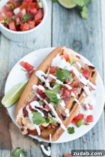 Jalapeño Cheddar Pretzel Hot Dogs with Turkey Chili Cheese 3 Sonoran Hot Dogs, a gourmet hot dog topped with beans, cheese, bacon, pico de gallo, guacamole, and sour cream, a true crowd-pleaser.