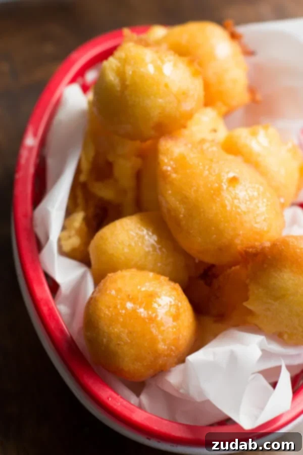 Fluffy Corn Fritters with Sweet Honey Butter Close-up of fluffy corn fritters drizzled with sweet honey butter