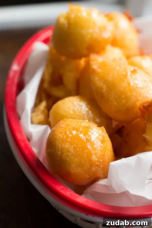 Honey Butter Corn Fritters in a Rustic Bowl Honey butter corn fritters served in a rustic bowl