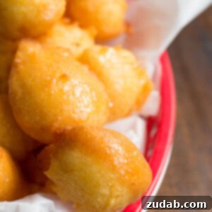 Plate of fresh honey butter fried corn fritters, ready to eat