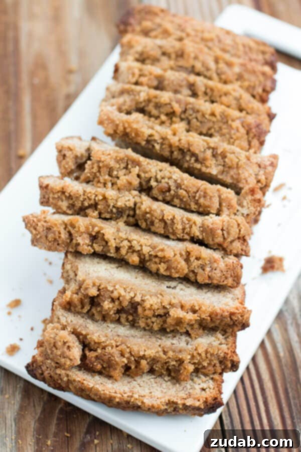 Warm slice of Banana Crumb Bread with a generous crumb topping