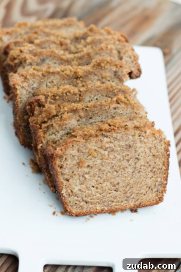Freshly baked Banana Crumb Bread cooling on a wire rack