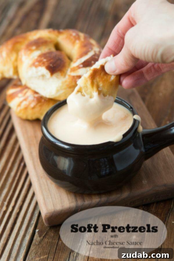 Soft pretzels with real cheese sauce A platter of soft pretzels and a bowl of golden cheese sauce, perfect for sharing