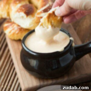 Golden Pretzels and Liquid Gold Cheese 2 The perfect soft pretzel with cheese sauce recipe ohsweetbasil.com