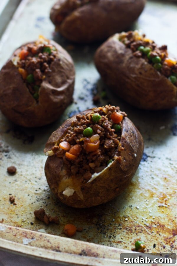Shepherd's Pie Twice Baked Potatoes Finished Shepherd's Pie Twice Baked Potatoes, ready to serve as individual, festive portions. The golden mashed potato topping hints at the delicious filling within.