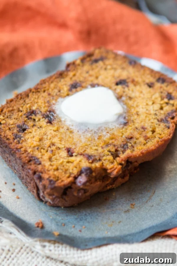 Pumpkin Bread for Little Hands An adorable child reaching for a slice of pumpkin chocolate chip bread, emphasizing its family appeal. ohsweetbasil.com