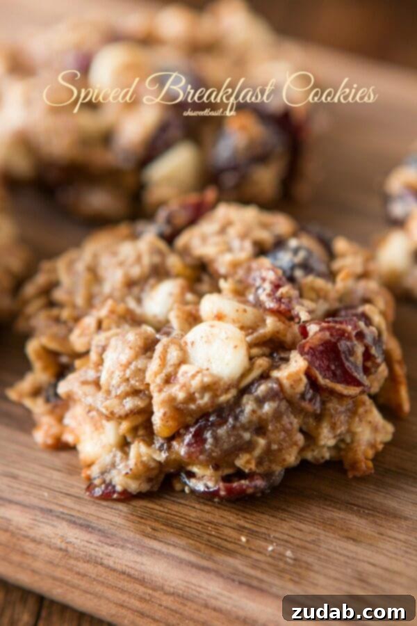 Spiced White Chocolate Cranberry Breakfast Cookies 13 A close-up, inviting image of spiced almond breakfast cookies on a serving plate, ready to be enjoyed as a perfect morning treat.