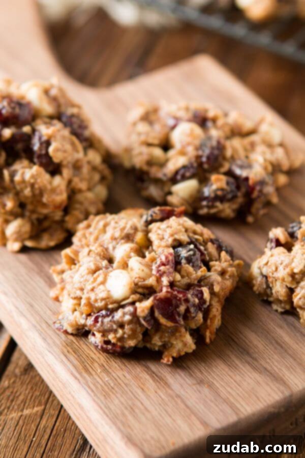 Spiced White Chocolate Cranberry Breakfast Cookies 8 A neat stack of healthy spiced almond breakfast cookies, ready to be enjoyed as a wholesome and satisfying treat.