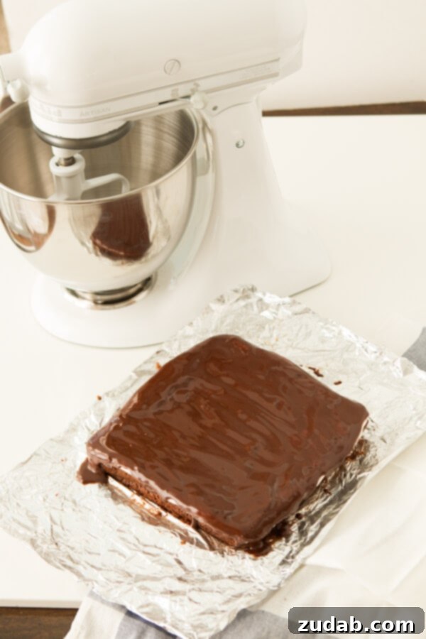 Sliced Peppermint Patty Brownies A side view of the Peppermint Patty Brownies, cut into neat squares, displaying the perfect thickness of each layer – fudgy brownie, creamy mint, and crisp chocolate. Ideal for serving at parties or as a special treat.